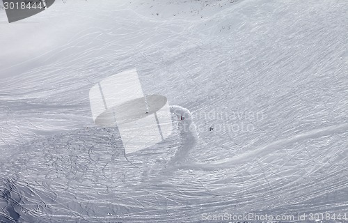 Image of Snowboarders and skiers on ski slope