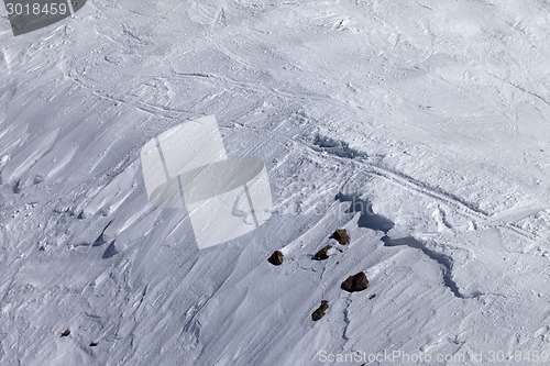 Image of Off-piste slope with snow cornice and stones