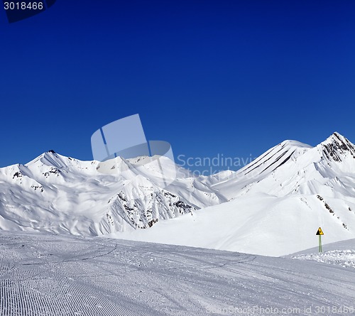 Image of Ski slope and warning sign