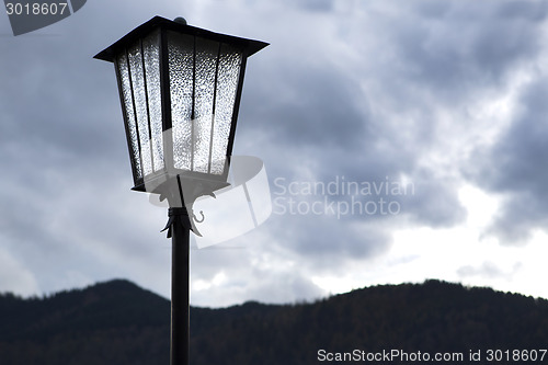 Image of Street lamp in front of mountains