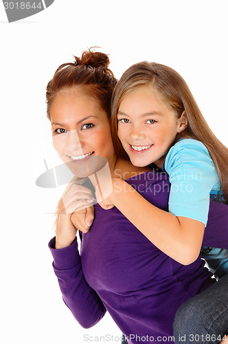 Image of Mother piggyback her daughter.