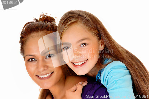 Image of Closeup mother piggyback daughter.