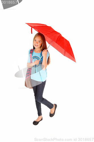 Image of Young girl standing with umbrella.