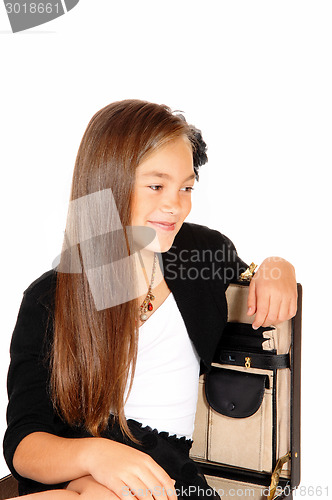 Image of Smiling girl in briefcase.