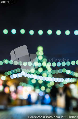 Image of Decorated Christmas tree. Abstract blurred lights background