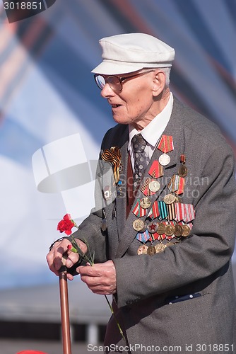 Image of Old veteran of World War II near tribunes