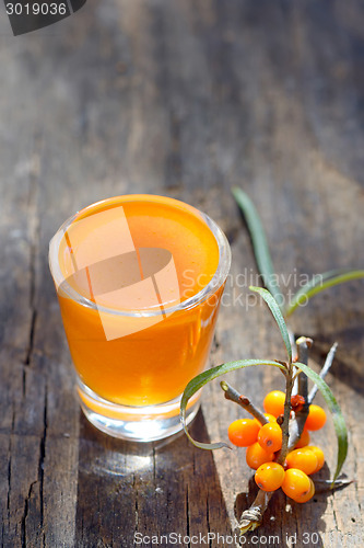 Image of Sea buckthorn juice and berries