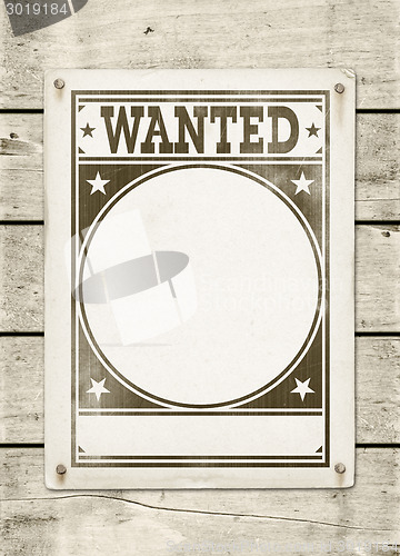 Image of Wanted poster on a wood board