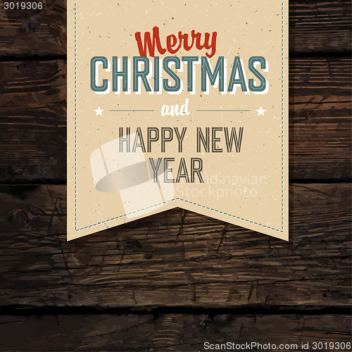 Image of Merry Christmas VIntage Tag Design On Red Planks. Vector