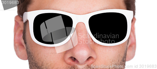 Image of Close-up of a man wearing white sunglasses 