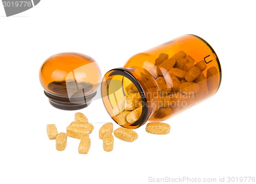 Image of Open bottle and pills