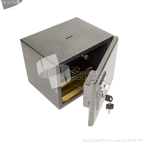 Image of Opened safe with golden piece.
