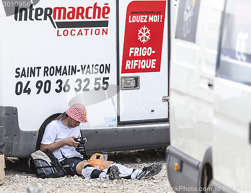 Image of Amateur Photographer Checking the Images