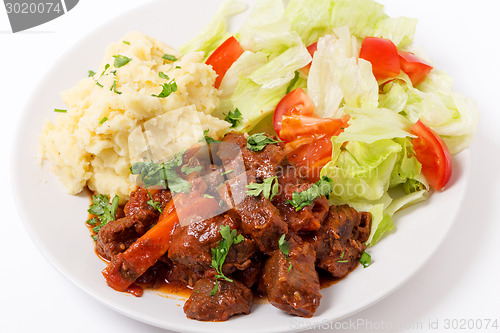 Image of Greek beef in red sauce