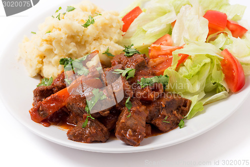 Image of Greek beef in red sauce