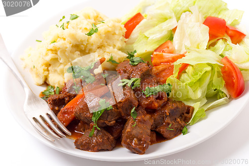 Image of Greek beef in red sauce