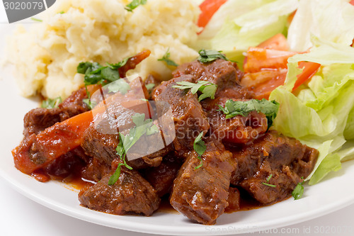 Image of Greek beef in red sauce