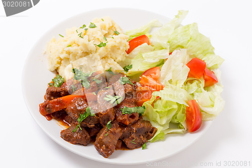 Image of Greek beef in red sauce