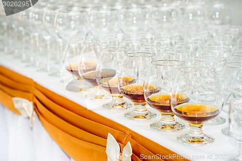 Image of many glasses on buffet table