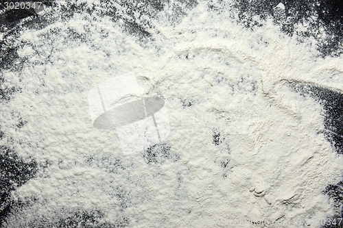 Image of White flour on black background