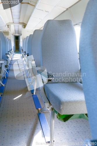 Image of Interior of an airplane with many seats