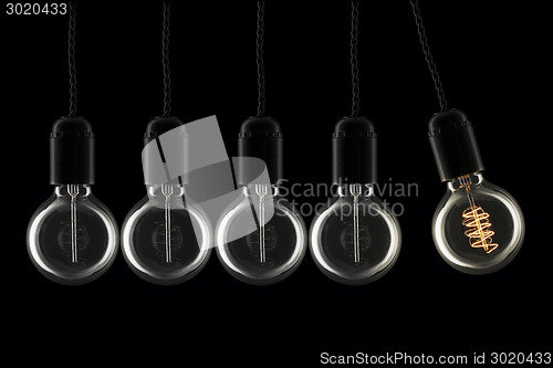 Image of Swinging lightbulb