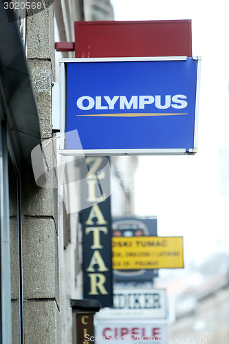 Image of Olympus shop sign in city centre