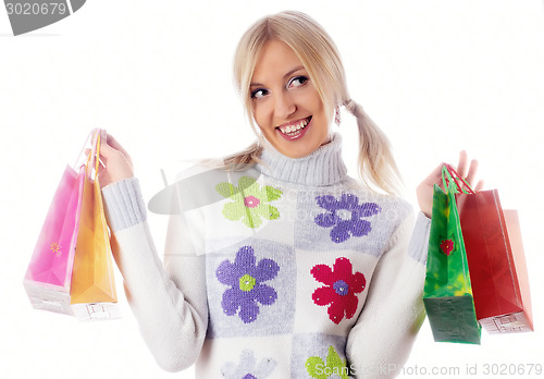 Image of Pretty smiling girl with shopping bags