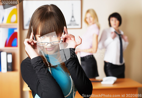 Image of Young pretty business lady in office