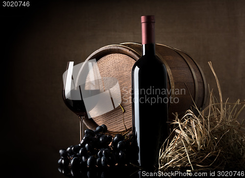 Image of Wine with grape and barrel