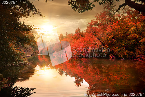 Image of Autumn sunset over river