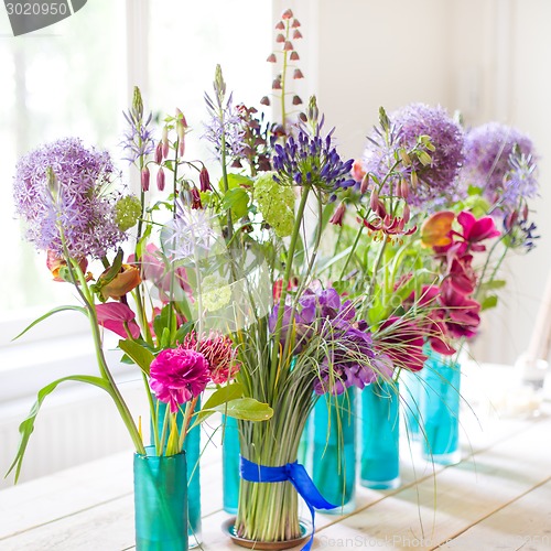 Image of Beautiful spring flowers on wooden table.