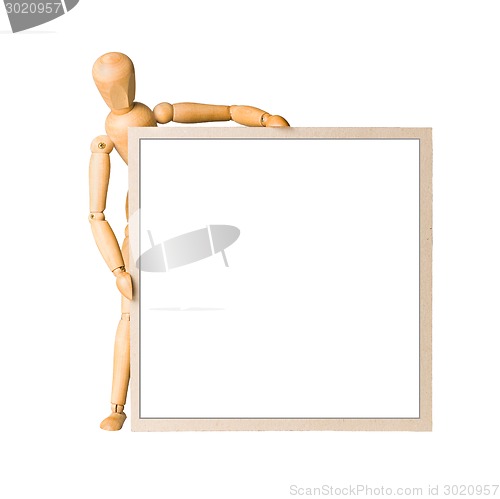 Image of Wooden model dummy holding square cardboard frame