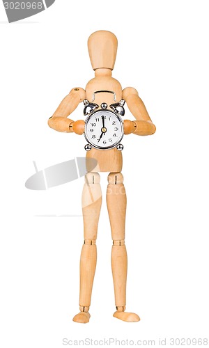 Image of Wooden model dummy holding alarm-clock