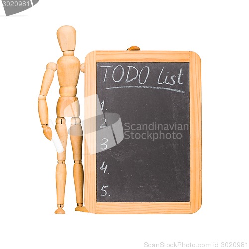 Image of Wooden dummy with chalkboard todo list