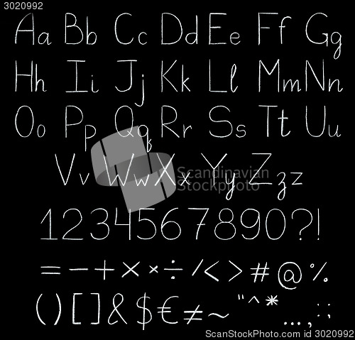 Image of Chalkboard alphabet isolated on black.