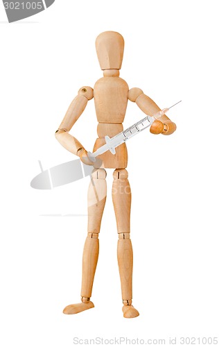 Image of Wooden mannequin holding syringe