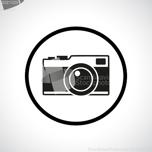 Image of Vintage photo camera in a circle.