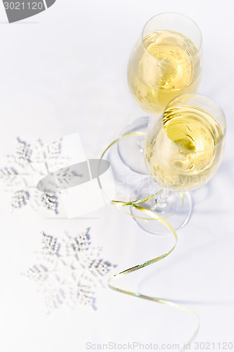 Image of Two glasses of wine and snowflakes