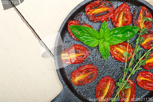 Image of baked cherry tomatoes with basil and thyme