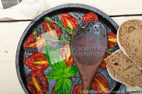 Image of baked cherry tomatoes with basil and thyme