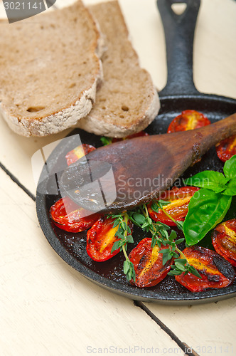 Image of baked cherry tomatoes with basil and thyme