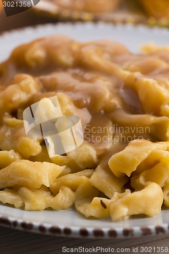 Image of homemade pumpkin tagliatelle with mushrooms