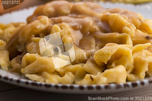 Image of homemade pumpkin tagliatelle with mushrooms