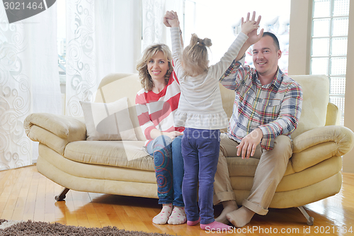 Image of happy young family at home