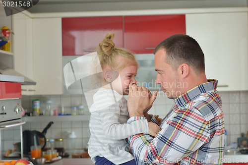 Image of happy young family at home