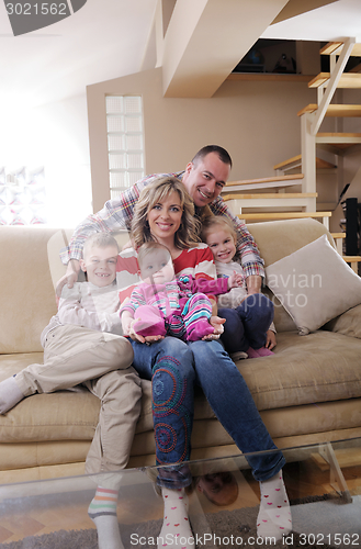 Image of happy young family at home