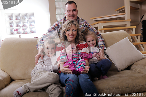 Image of happy young family at home