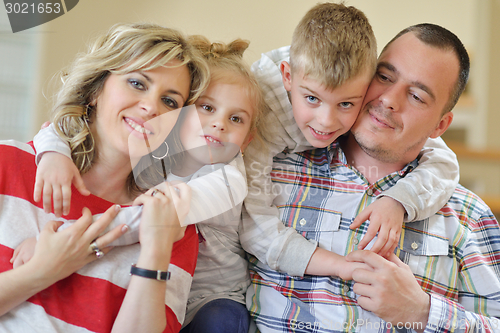 Image of happy young family at home