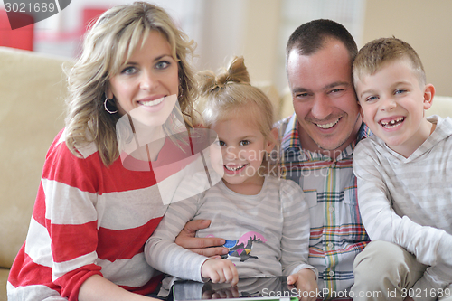 Image of happy young family at home